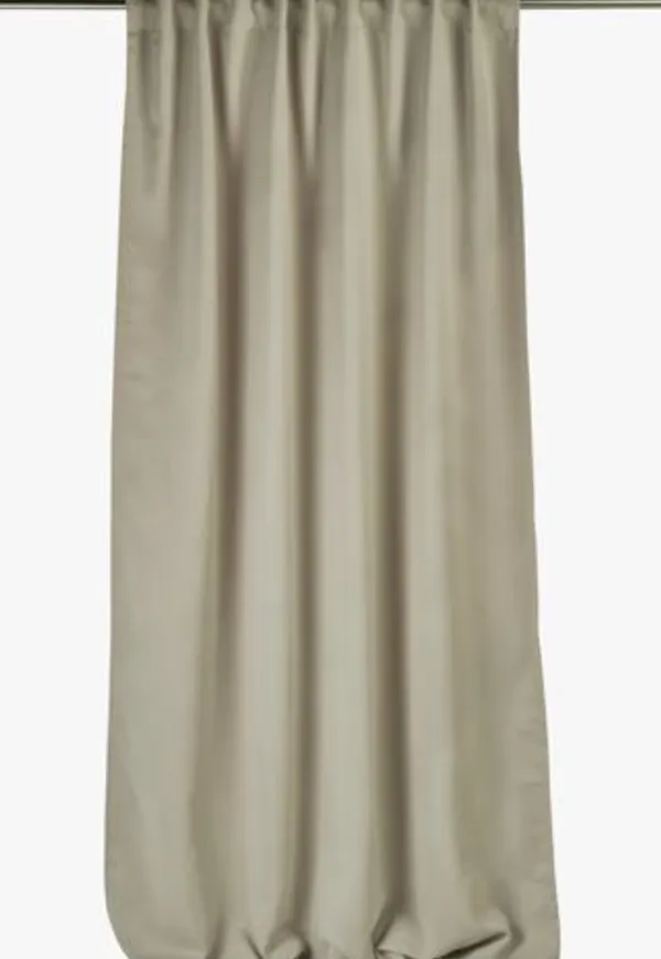 Beige hemtex-mörkläggningsgardin i stilriktig modell.