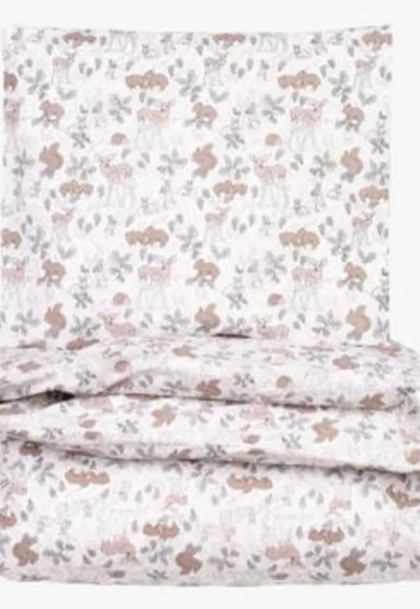 Ljusgrön Little Roomies-spjälsäng i modern modell.