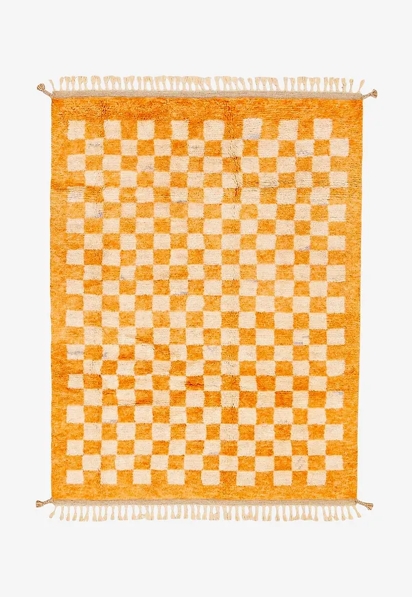 Trendig bargi matta i orange färg gjord i ull.