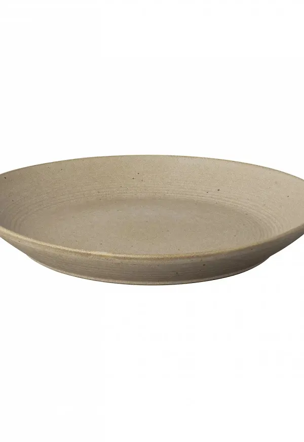 Beige Blomus-salladsskål i stilren modell.
