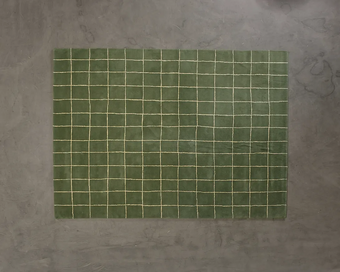 Riktigt snygg matta i grön färg gjord i ull.