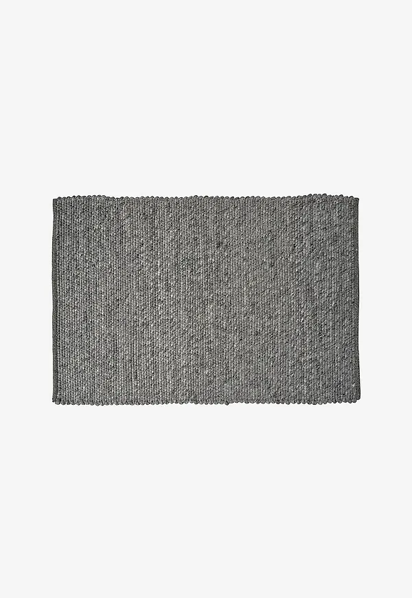 Komfortabel matta i grå färg gjord i ull.