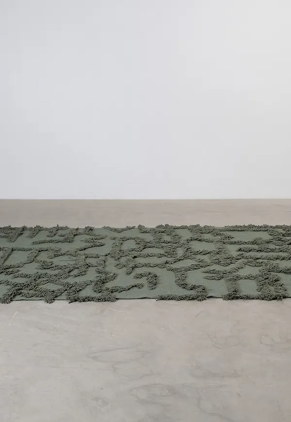 Trendig classic collection matta i mörkgrön färg gjord i bomull.