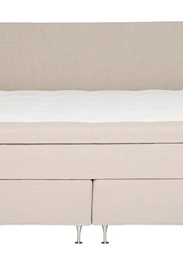 Superfin säng i beige färg gjord i ek.