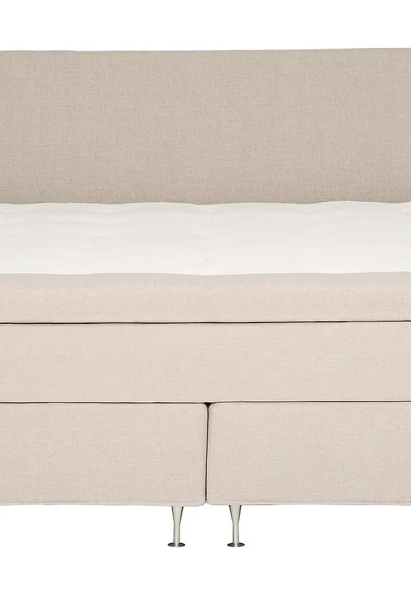 Moderiktig säng i beige färg gjord i ek.