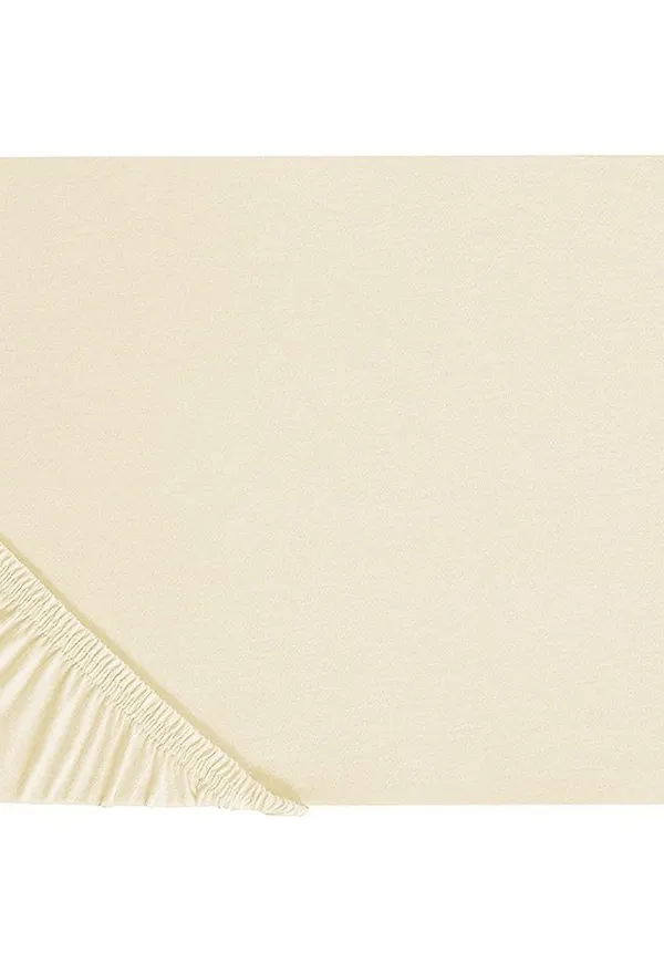 Elegant sängkläder i beige färg gjord i bomull.