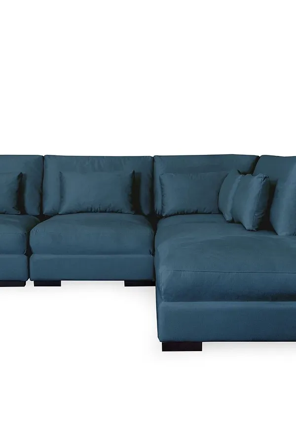 Blå Scandinavian Choice-schäslongsoffa i mysig modell.