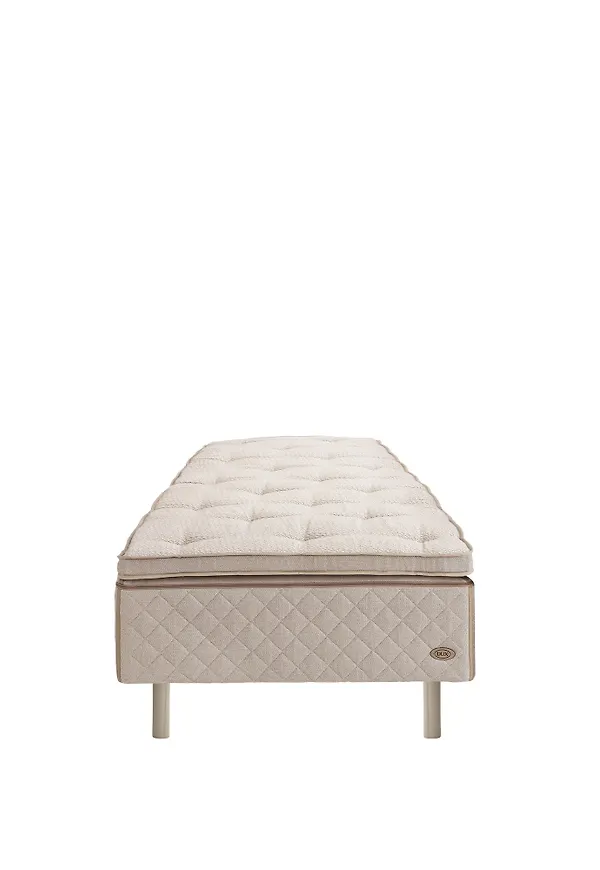 Otroligt fin beige säng i bomull från DUX.
