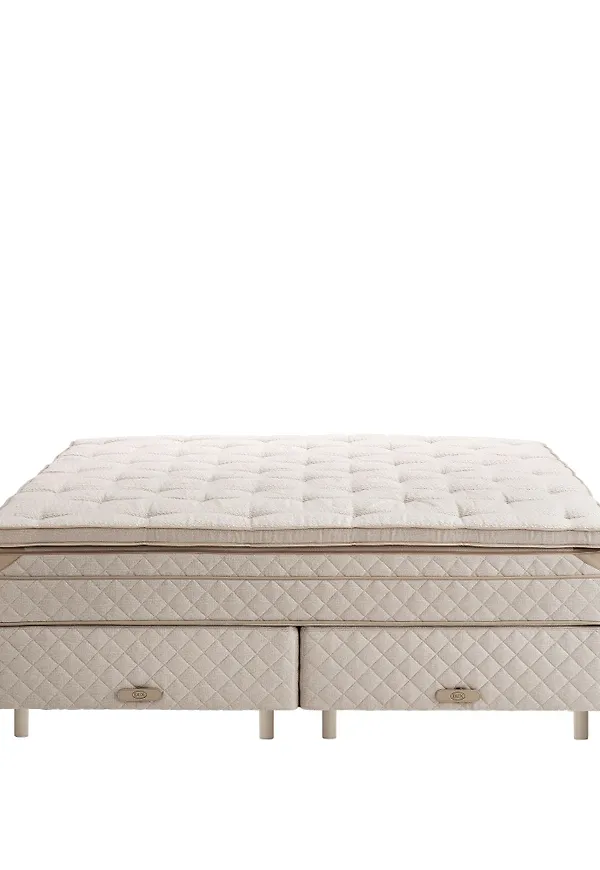 Elegant beige säng i läder från DUX.