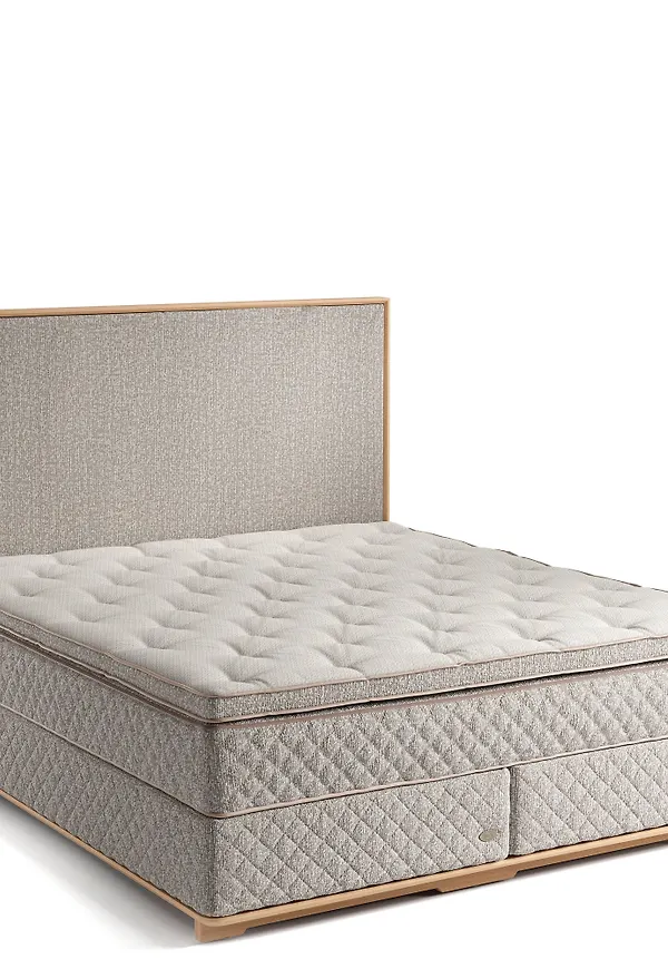 Beige DUX-säng i ek i mysig modell.