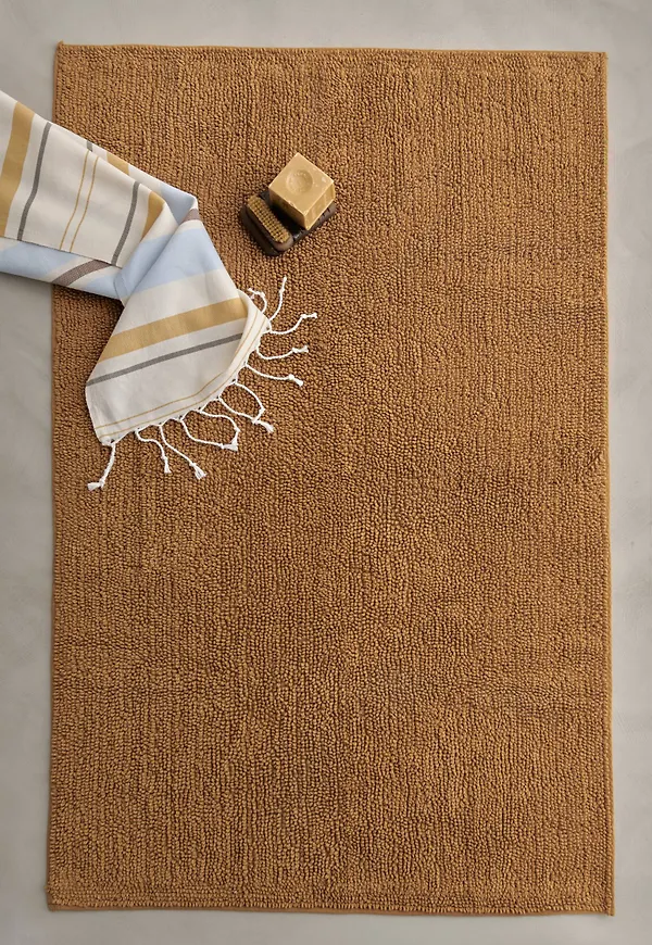 Cool bomullsbadrumsmatta i senapsgult från Ellos.