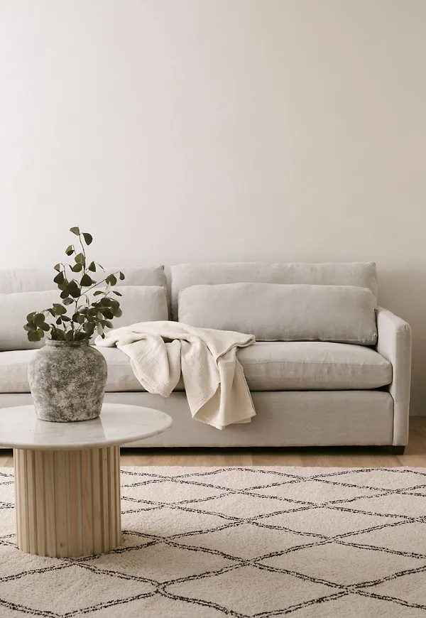 Beige Ellos-soffa i snygg modell.