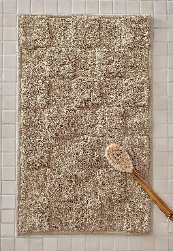 Mysig ellos home matta i beige färg gjord i bomull.