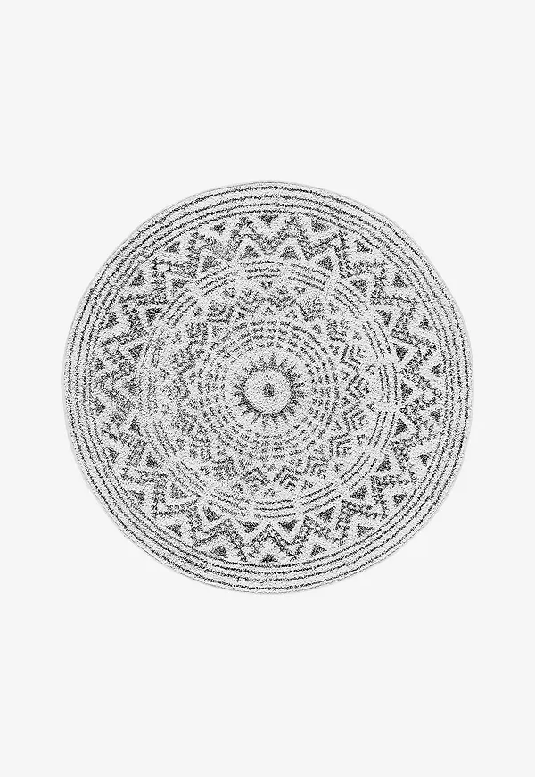 Snygg badrumsmatta i vit färg gjord i bomull.