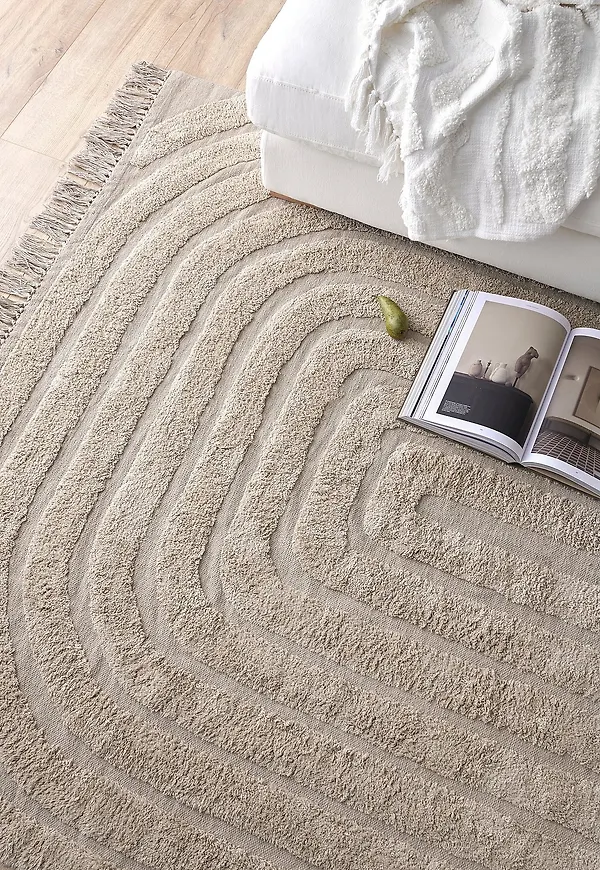 Komfortabel ellos matta i beige färg gjord i bomull.