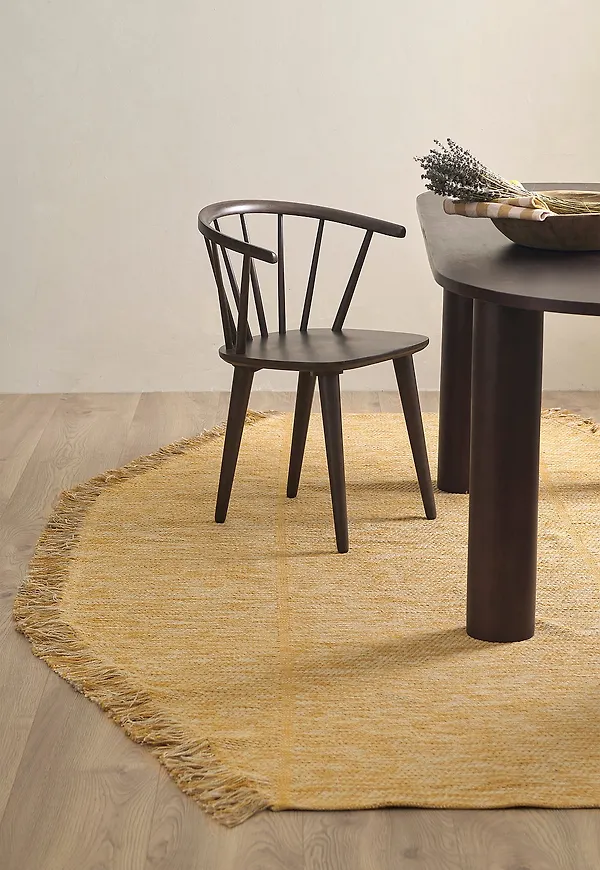 Skön ellos home ellos matta i gul färg gjord i bomull.