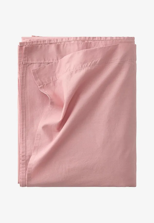 Trendig säng i rosa färg gjord i bomull.