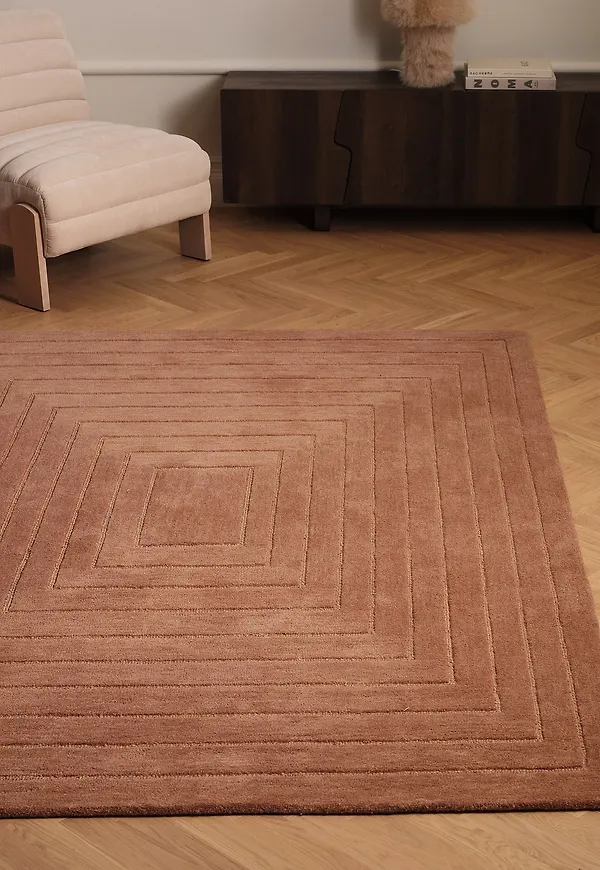 Smickrande ellos home matta i rosa färg gjord i ull.