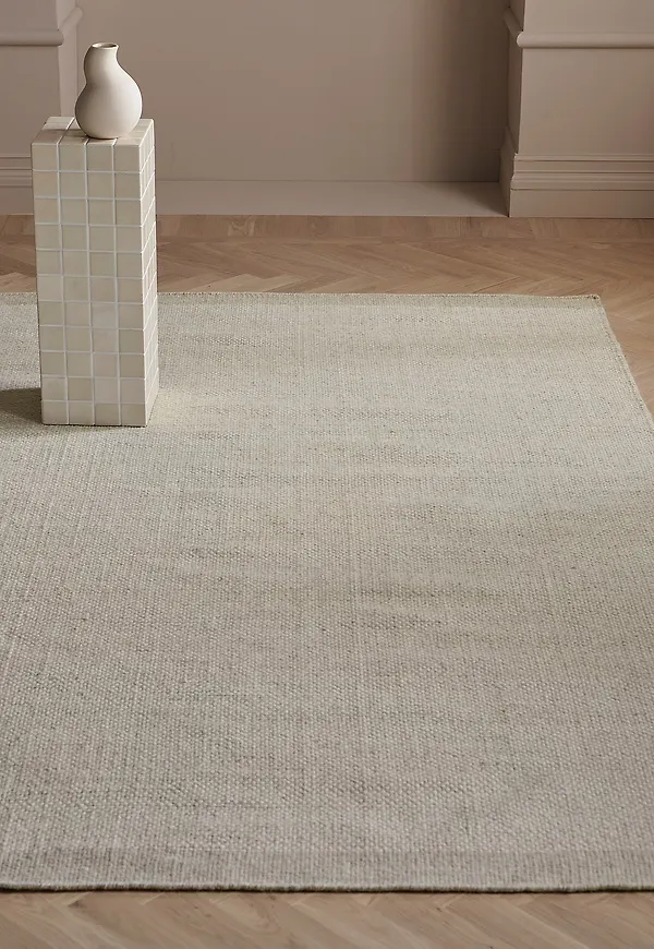 Söt ellos home ellos matta i beige färg gjord i ull.