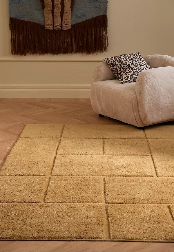 Komfortabel ellos home matta i gul färg gjord i ull.