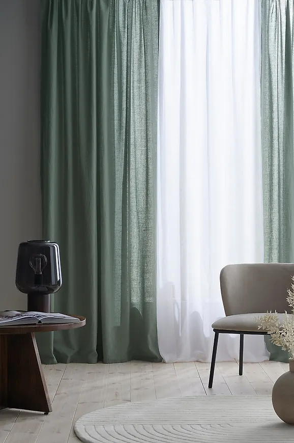 Grön Ellos Home-gardinstång i härlig modell.