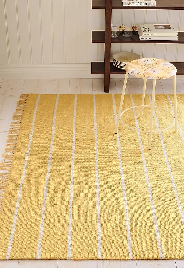Modern ellos home ellos matta i gul färg gjord i bomull.