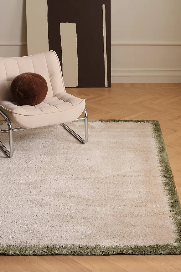 Grön Ellos Home-ryamatta i cool modell.