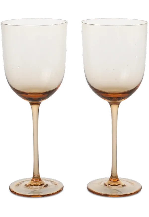 Rosa FERM LIVING-vitvinsglas i fin modell.