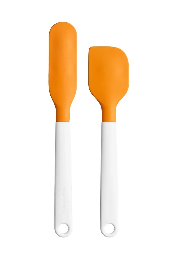 Orange Fiskars-slickepott i moderiktig modell.