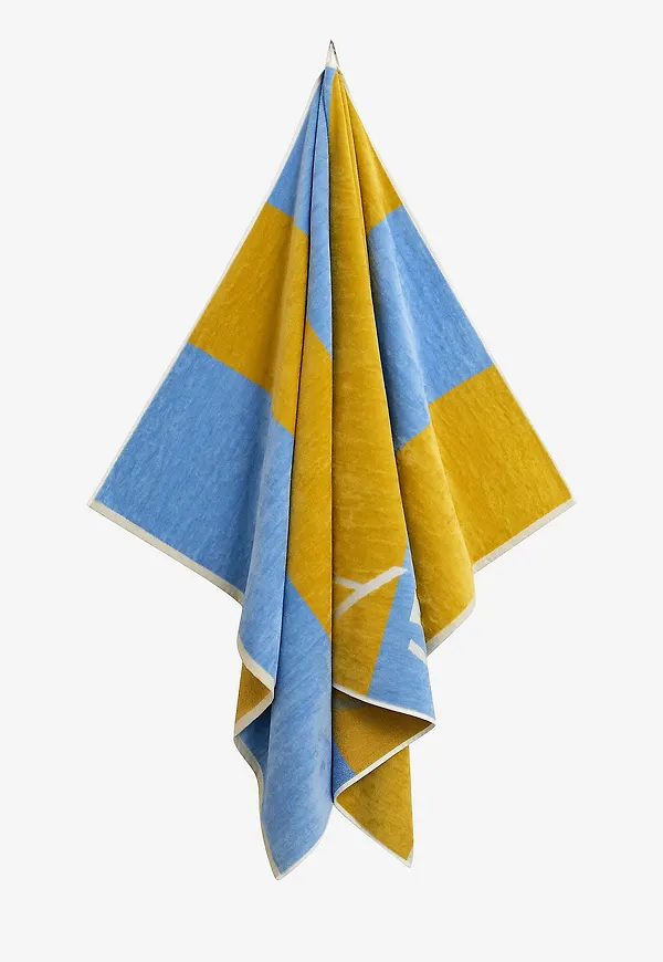 Klassisk strandhandduk i gult från Gant Home.