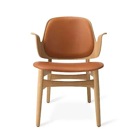 Supersnygg warm nordic fåtölj i beige färg gjord i läder.