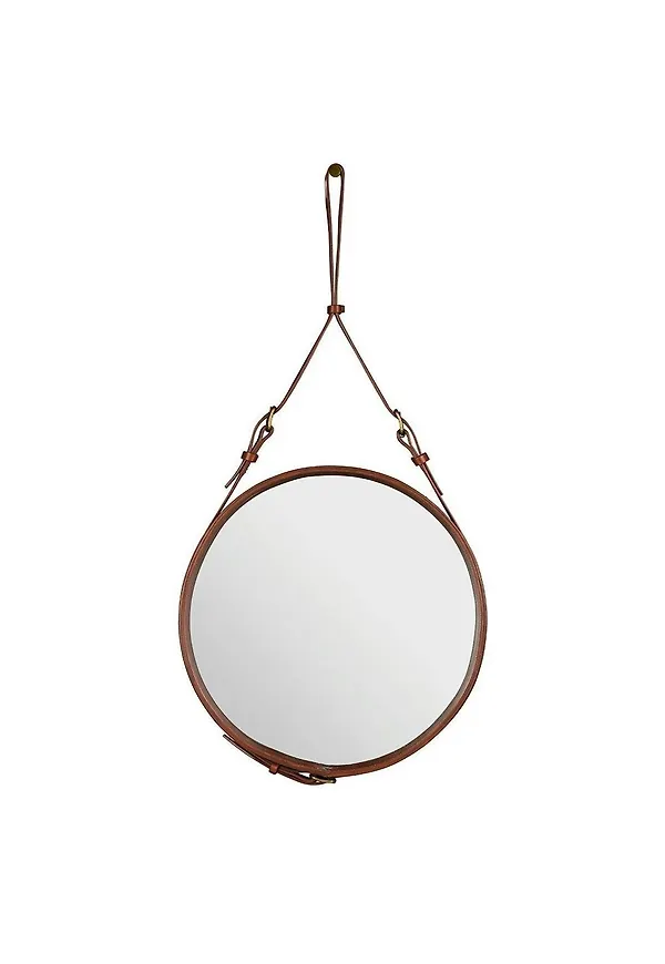 Otroligt snygg väggspegel i brunt från Gubi.