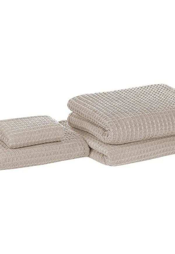 Skön gästhandduk i beige färg gjord i bomull.
