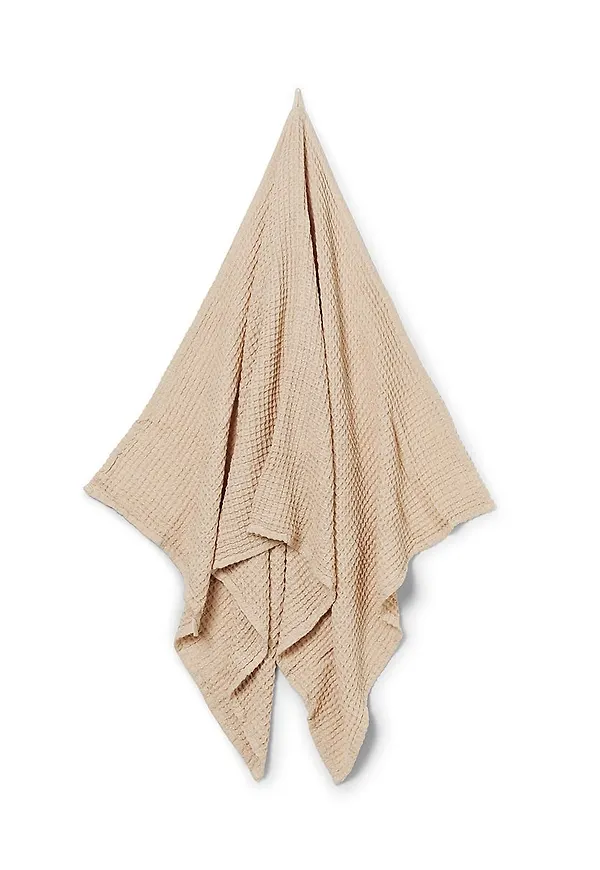 Otroligt snygg handduk i beige färg gjord i bomull.
