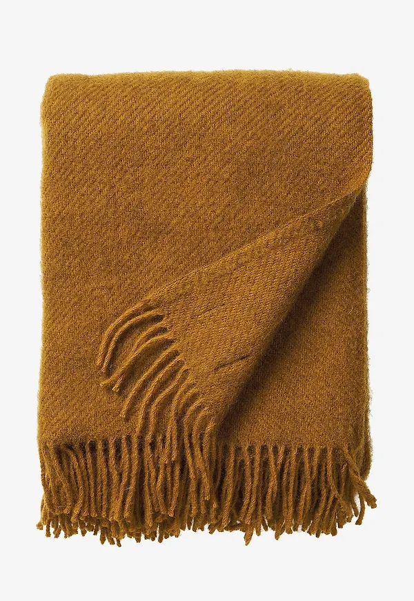 Beige Klippan Yllefabrik-ullpläd i jättesnygg modell.