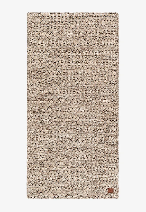 Elegant beige matta i ull från KM Home.