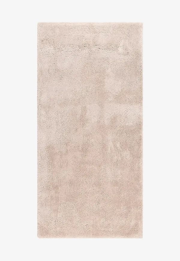 Beige KM Home-ryamatta i jättefin modell.