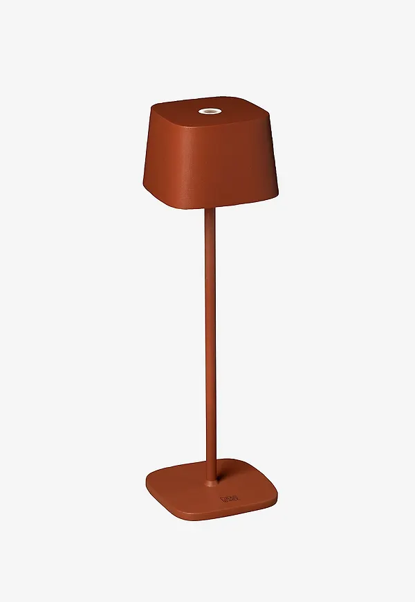 Orange Konstsmide-bordslampa i klassisk modell.