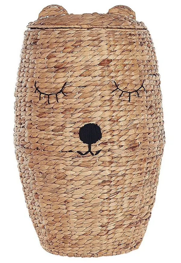Komfortabel korg i beige färg gjord i järn.