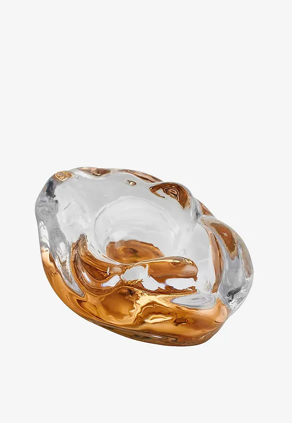 Guld Kosta Boda-skulptur i ikonisk modell.