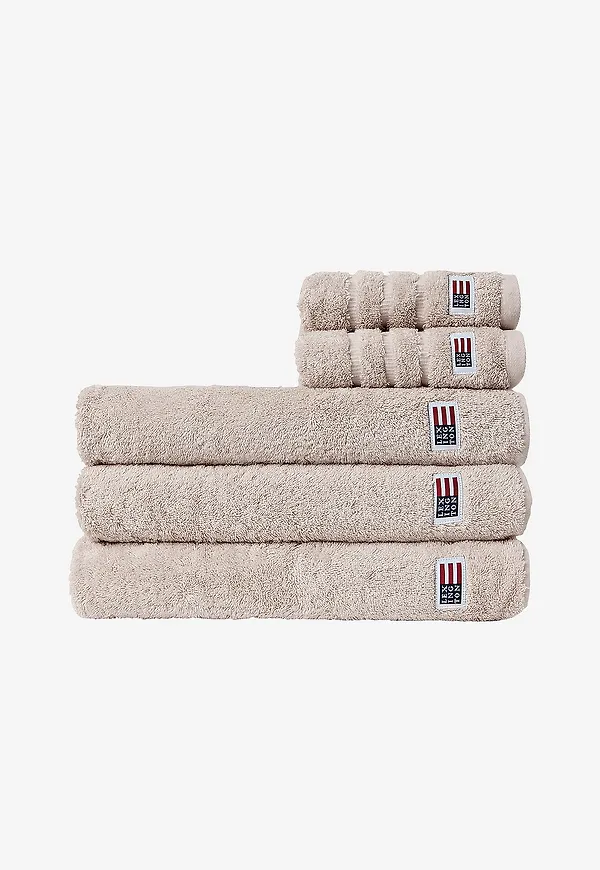 Beige Lexington-handduk i komfortabel modell.