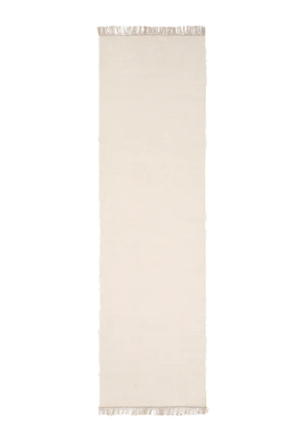 Fin matta i vit färg gjord i ull.