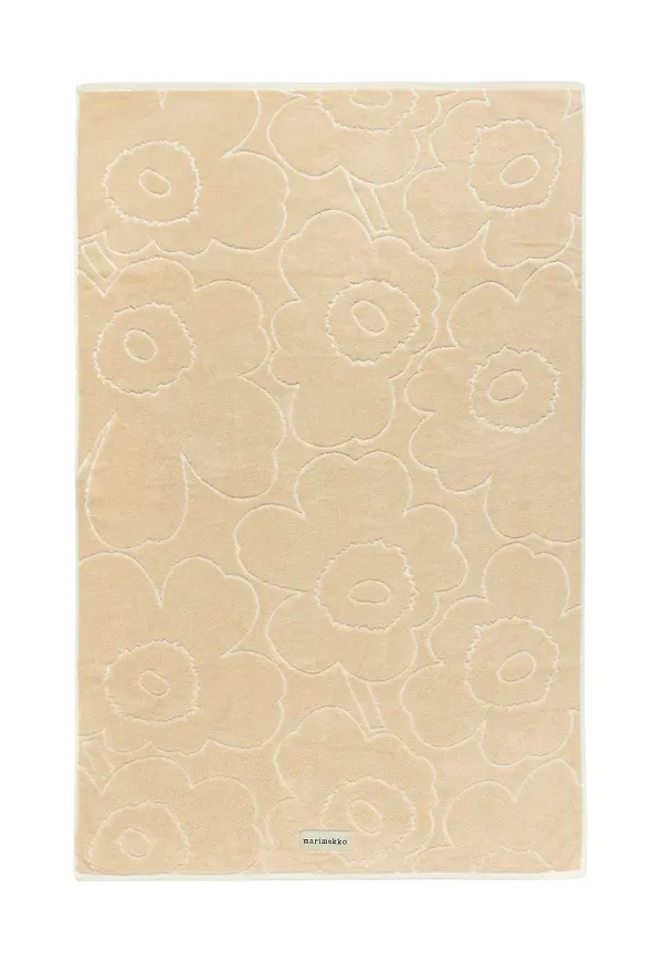 Moderiktig badhandduk i beiget från Marimekko.