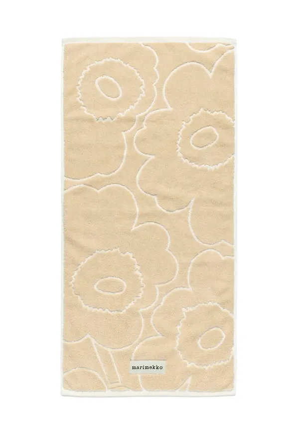 Beige Marimekko-handduk i moderiktig modell.