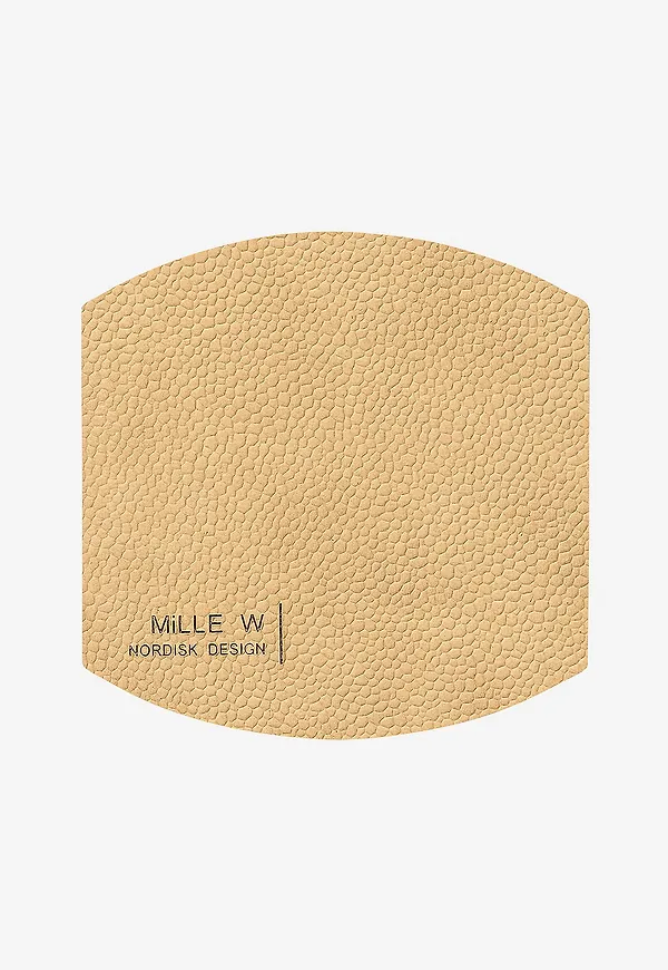 Otroligt fin glasunderlägg i beiget från MiLLE W NORDISK DESIGN.