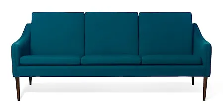 Smickrande warm nordic fåtölj i turkos färg gjord i valnöt.