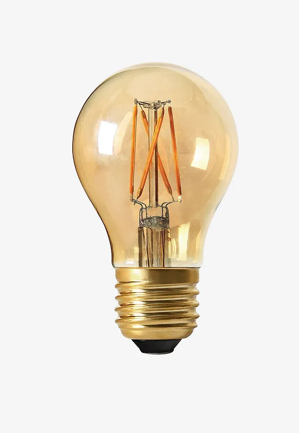 Guld PR Home-lampa i mysig modell.