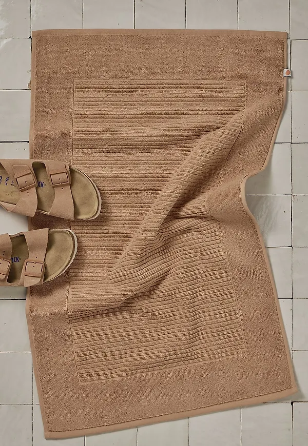 Vacker beige matta i bomull från Pure.