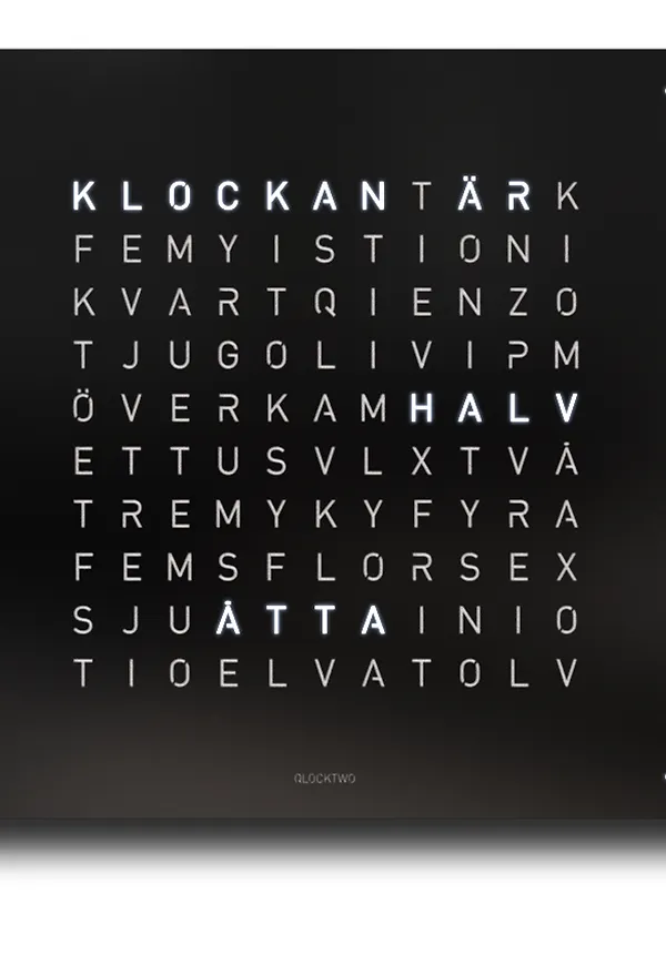 Svart Qlocktwo-bordsklocka i fantastiskt snygg modell.
