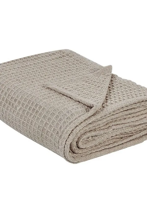 Elegant sängkläder i beige färg gjord i bomull.